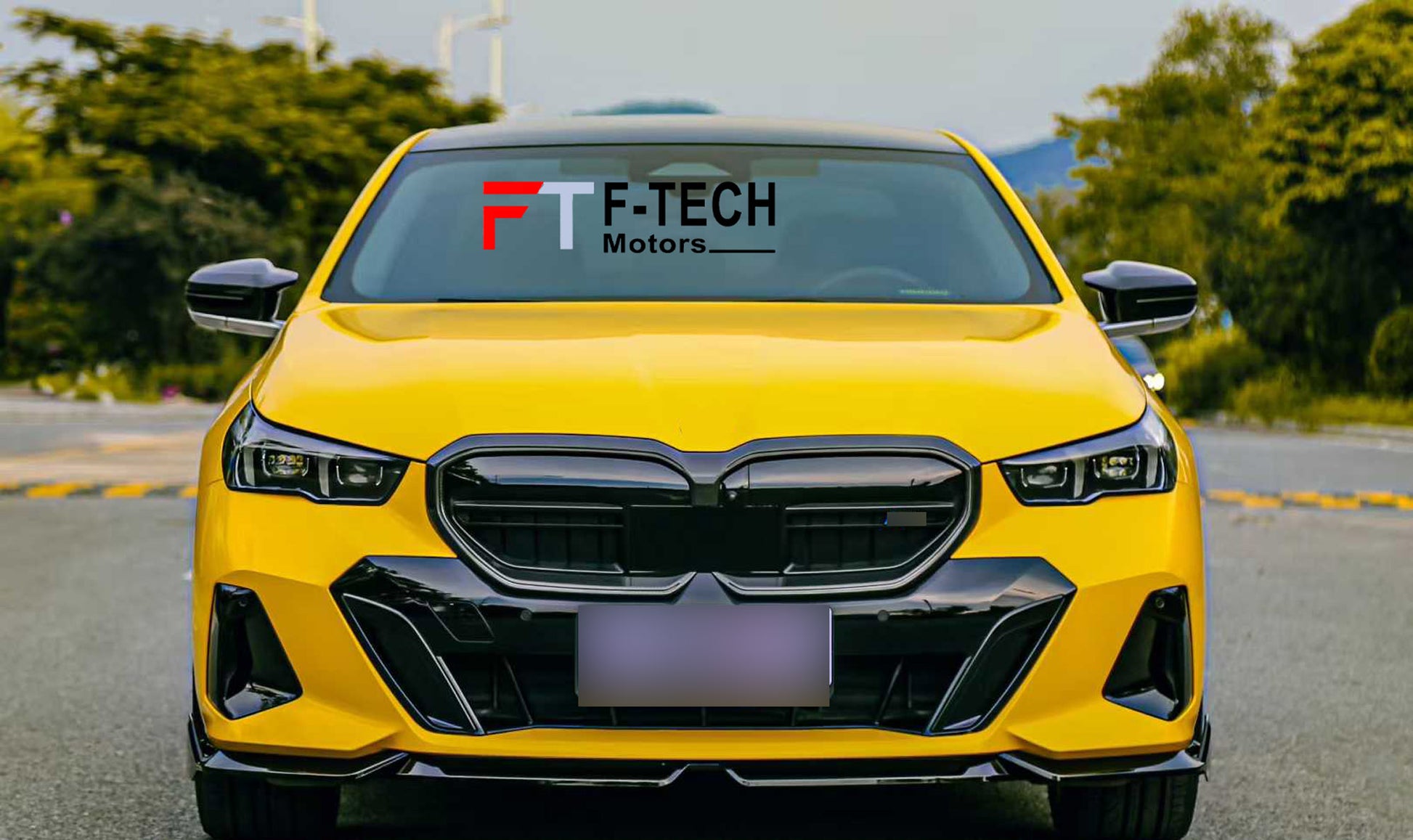 Yellow car with F-Tech Motors decal on a road