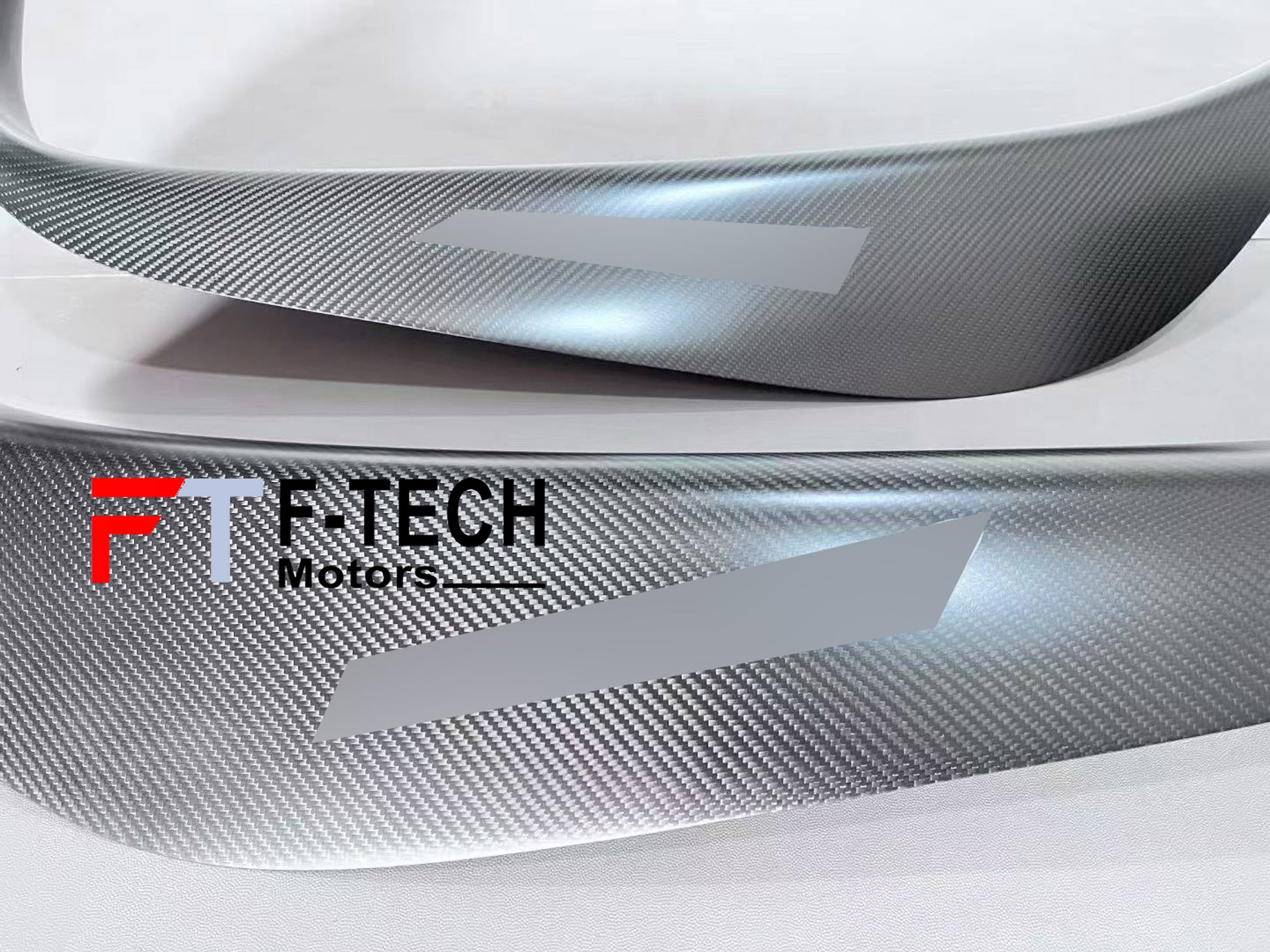 Carbon fiber car wrap with F-Tech Motors logo on a vehicle surface