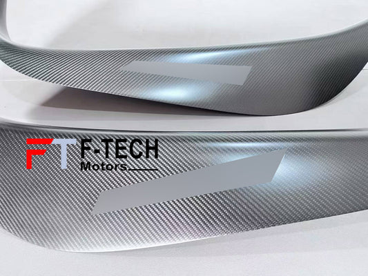 Carbon fiber car wrap with F-Tech Motors logo on a vehicle surface